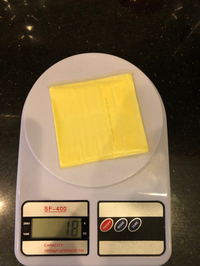 Gewicht eines Stücks Käse
