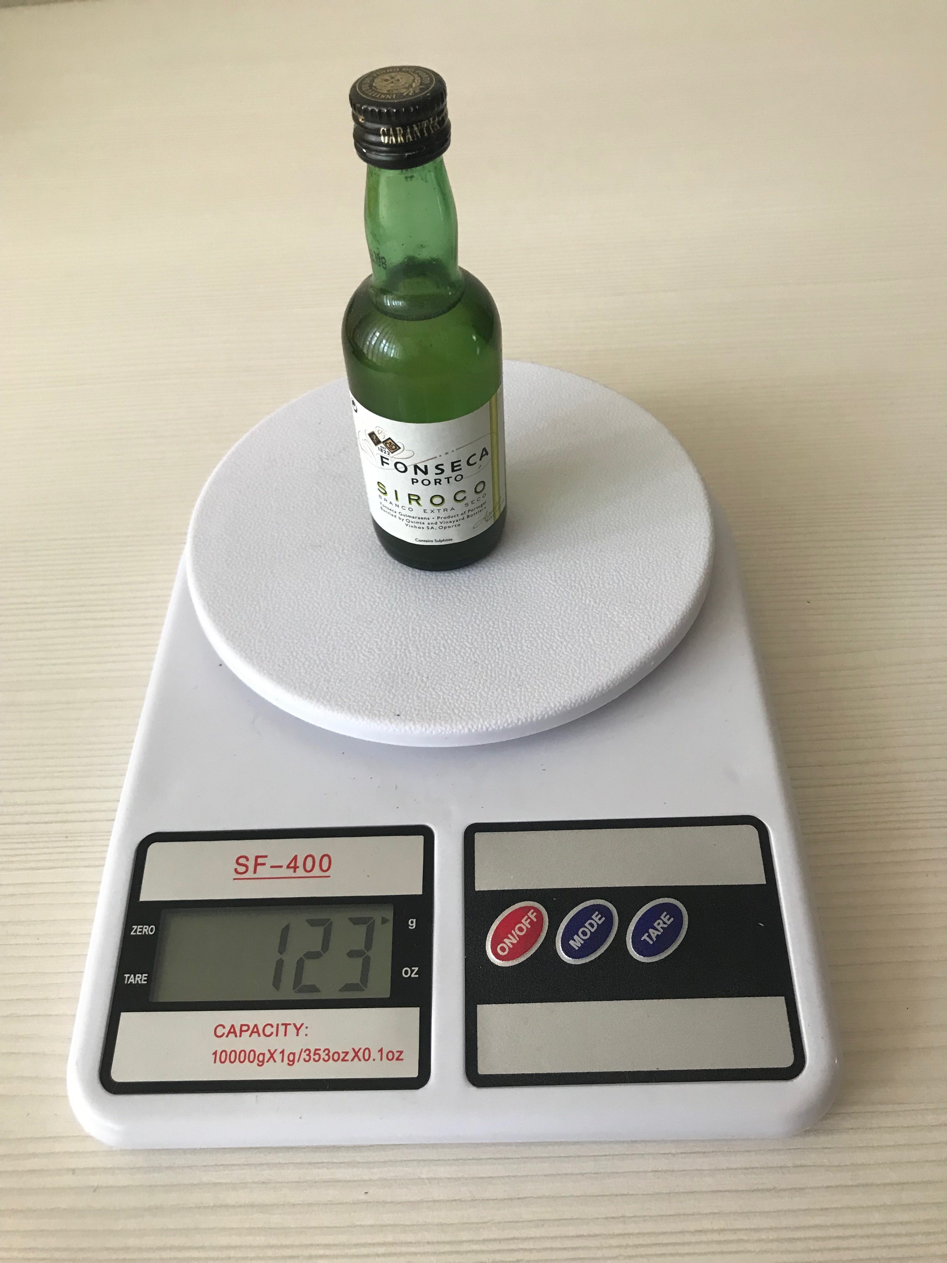 the weight of the mini bottle from the bar