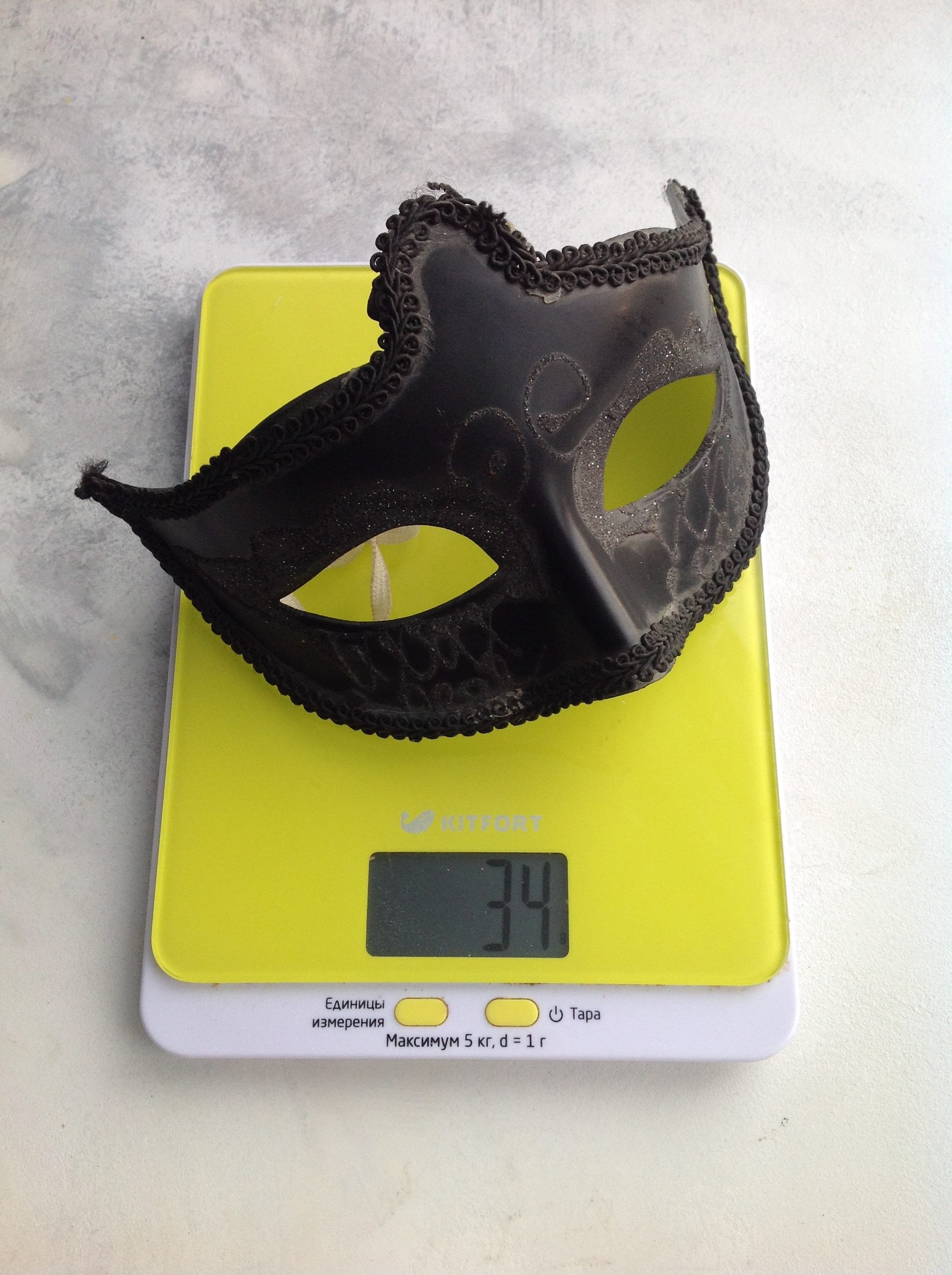 weight of the black carnival eye mask