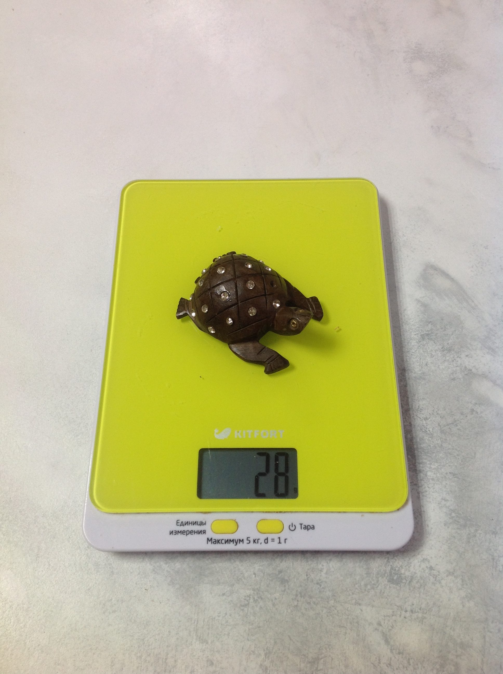 How much does a small wooden souvenir turtle weigh?